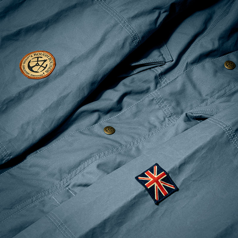 Badge detail view of a Shimi smock in Blue