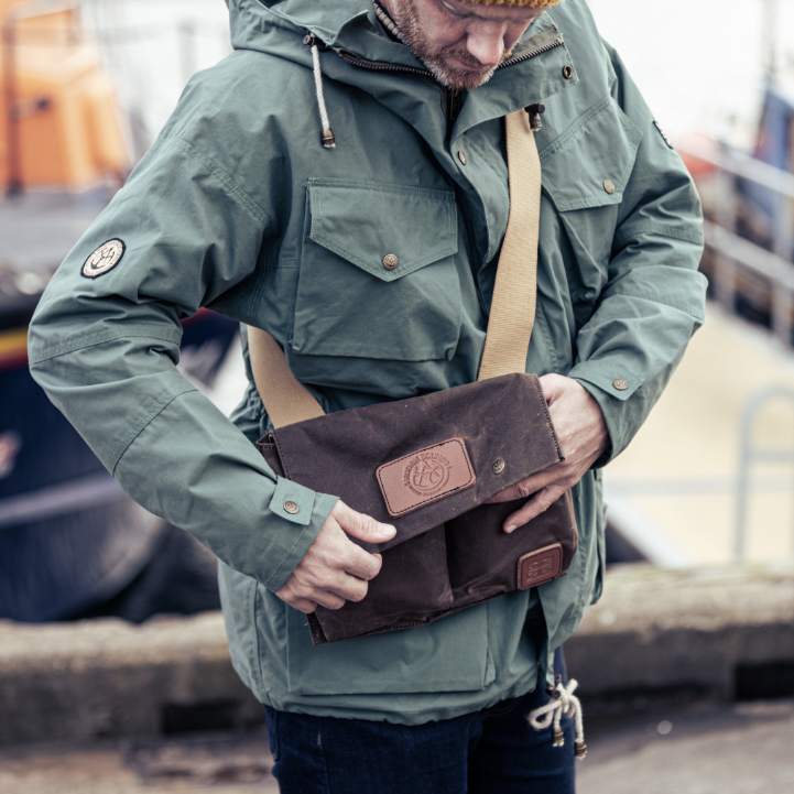 Man looking in Pioneer Bag at waist