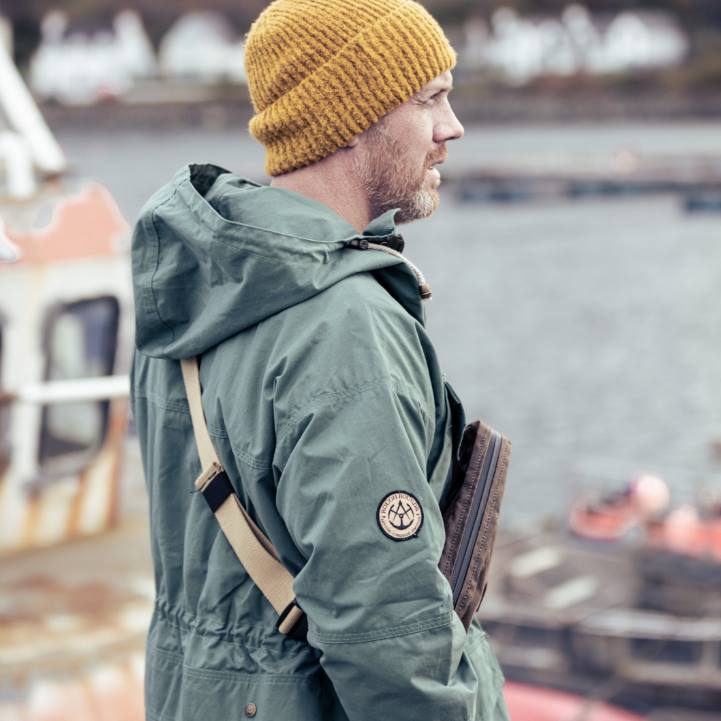 Side view of man wearing Shimi Smock and Close Hold Bag